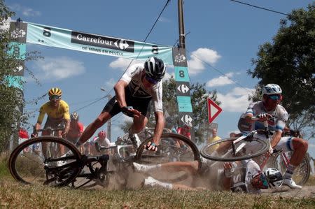 Team Sky rider Chris Froome of Britain crashes during stage 9. REUTERS/Benoit Tessier