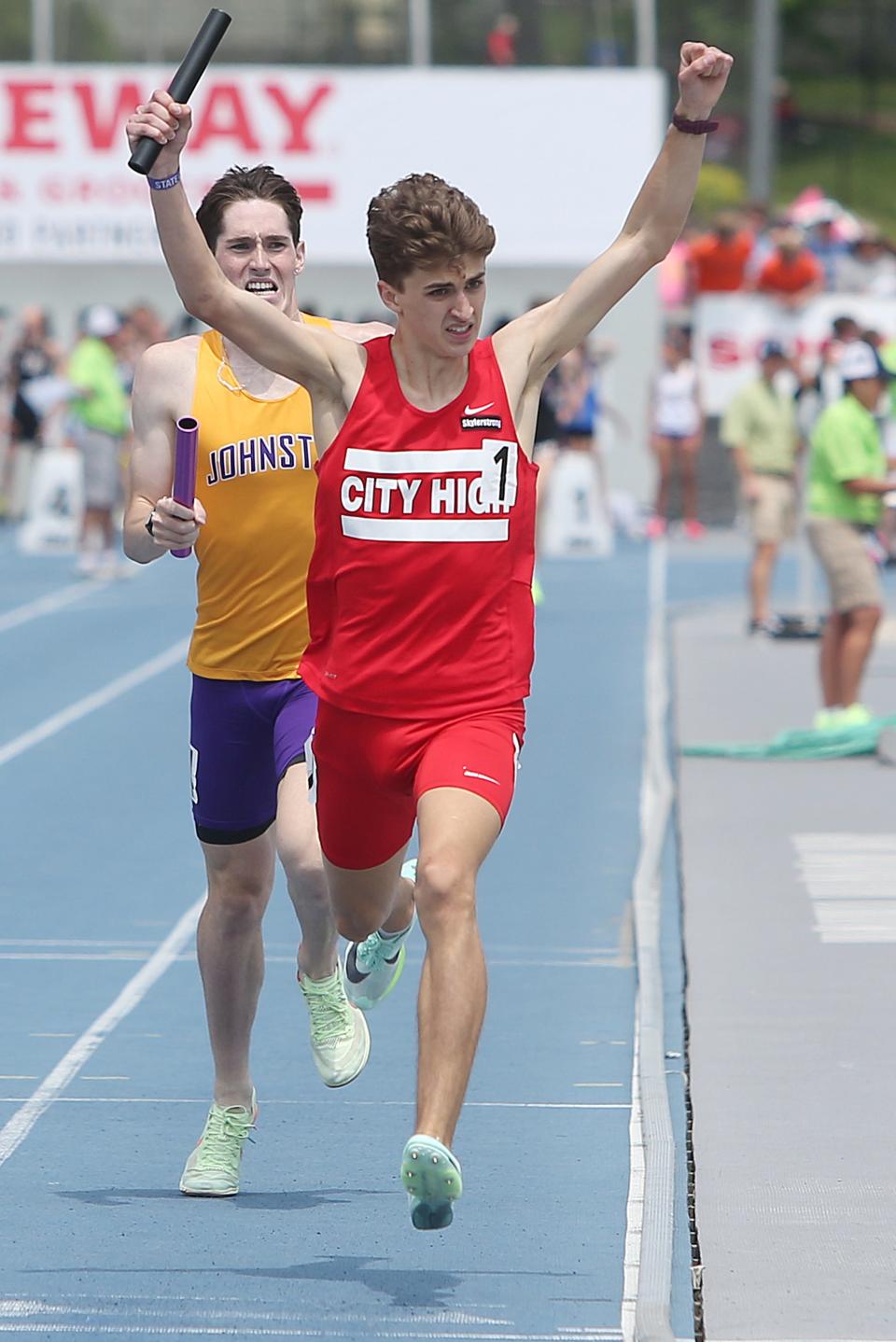 Iowa City anchor runner Truman Thompson celebrates while finishing the 4x800-meter relay in the Iowa state track meet.