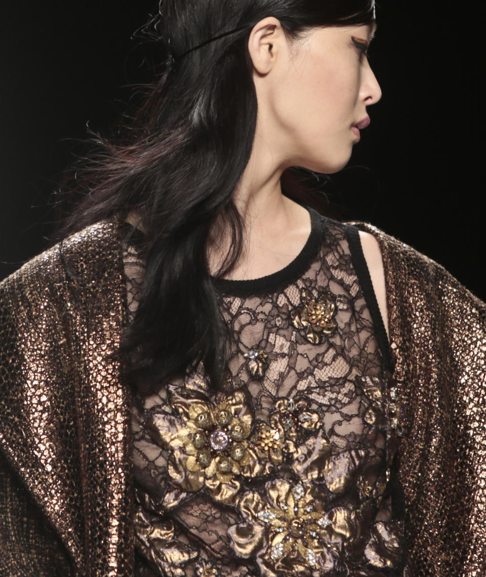 Fashion from the Badgley Mischka Fall 2014 collection is modeled during New York Fashion Week on Tuesday Feb. 11, 2014. (AP Photo/Bebeto Matthews)