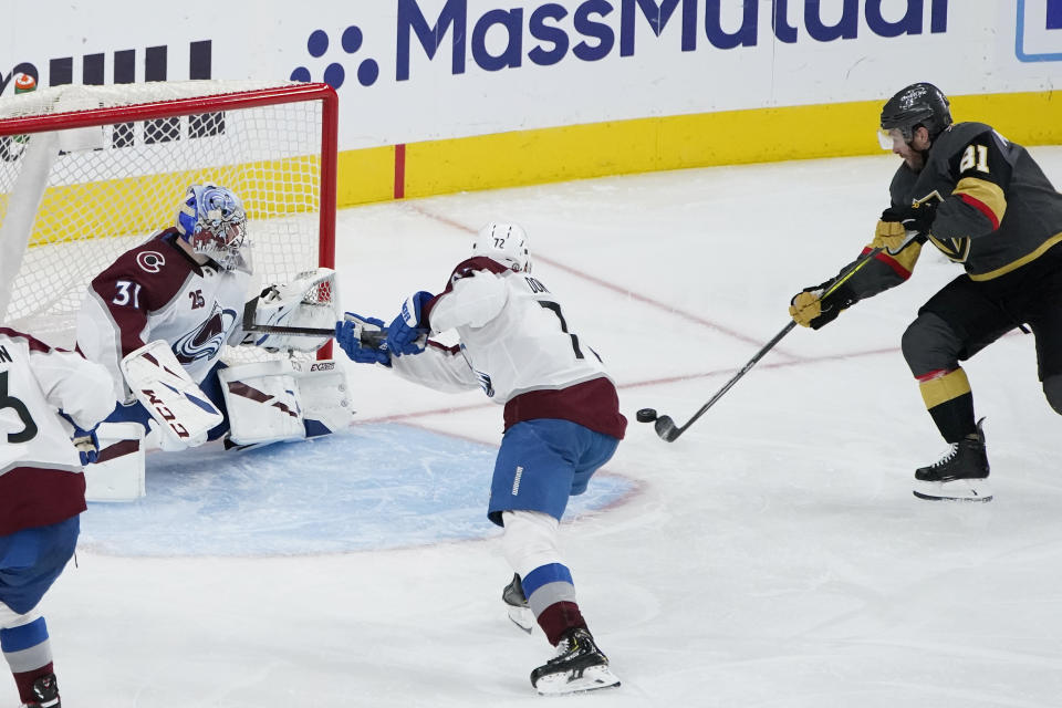 Vegas Golden Knights center Jonathan Marchessault (81) scores a goal against Colorado Avalanche goaltender Philipp Grubauer (31) during the third period in Game 4 of an NHL hockey Stanley Cup second-round playoff series Sunday, June 6, 2021, in Las Vegas. The goal was his third of the game. (AP Photo/John Locher)