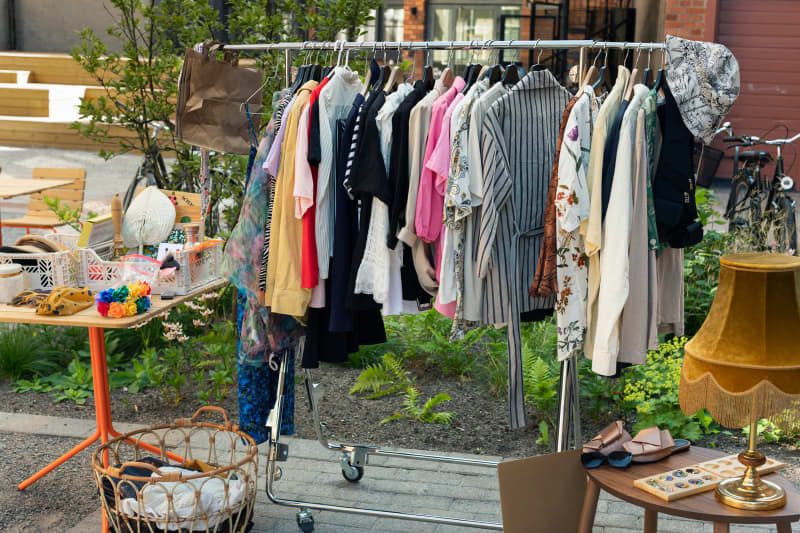 Clothes in rack at yard sale