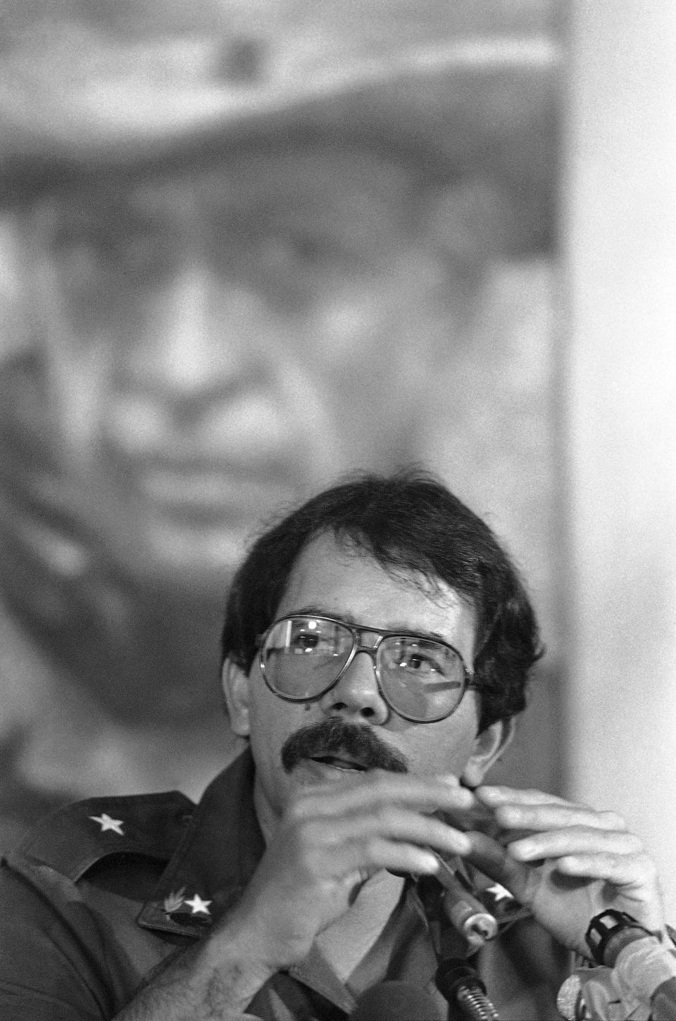 FILE - Sandinista presidential candidate Daniel Ortega answers a question, Nov. 5, 1984, during a news conference in Managua, Nicaragua. Ortega claimed victory during the conference. Pat Hamilton, a combat veteran of the Vietnam War who covered the civil wars in Central America as a photojournalist for The Associated Press, and who later worked at Reuters covering the Gulf War in Iraq, died Sunday, Aug. 13, 2023, after a long struggle with cancer. He was 74. (AP Photo/Pat Hamilton, File)