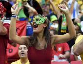 A Portugal fan attends the 2014 World Cup Group G soccer match against Ghana at the Brasilia national stadium in Brasilia June 26, 2014. REUTERS/Dylan Martinez (BRAZIL - Tags: SOCCER SPORT WORLD CUP)