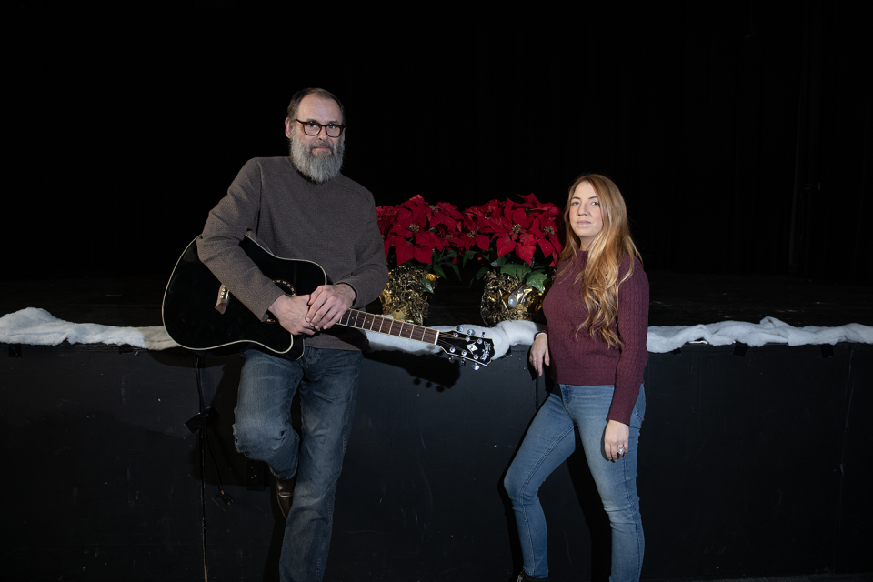 James A. Garfield High school English teacher Steve Howell and 2005 G-Men graduate Amanda Hart reunite at the school in Garrettsville. They, along with another former student of Howell's, Aaron Boyle, collaborated on a Christmas song as a class project nearly 20 years ago that has gotten the attention of the U.S. Air Force Band of Mid-America.