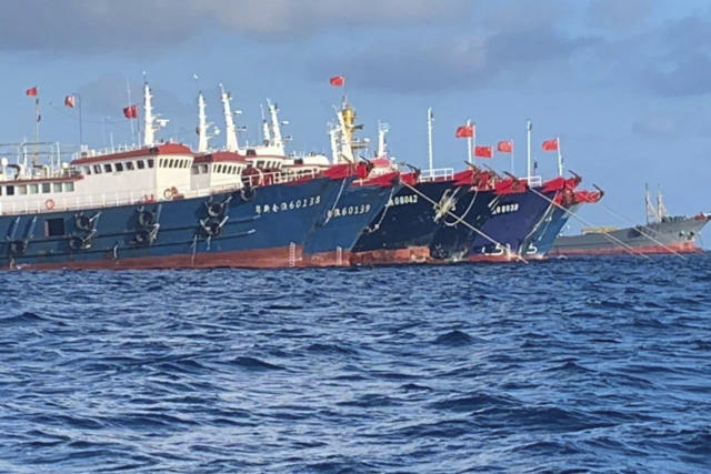 Chinese vessels moored at Whitsun Reef, South China Sea on March 27, 2021. Source: AP