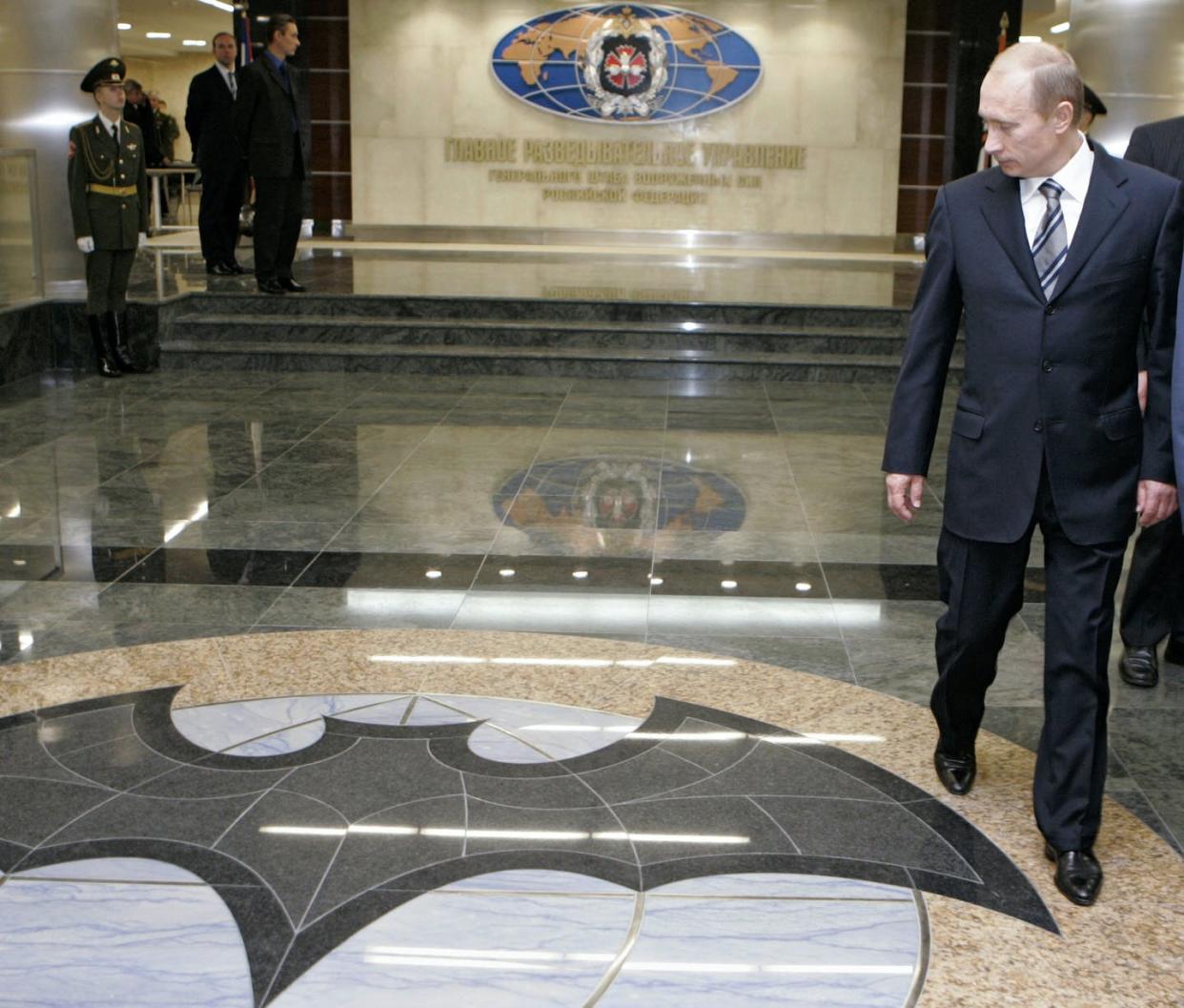 <span class="caption">Russian President Vladimir Putin walks through a hall in the building housing Russia's GRU military intelligence service.</span> <span class="attribution"><a class="link " href="https://newsroom.ap.org/detail/RussiaPoisonedSpyGRU/66d4b73d747e49d597e5a5c4aab14e2e/photo?Query=GRU%20Dmitry%20Astakhov&mediaType=photo&sortBy=arrivaldatetime:desc&dateRange=Anytime&totalCount=1&currentItemNo=0" rel="nofollow noopener" target="_blank" data-ylk="slk:Dmitry Astakhov, Sputnik, Government Pool Photo via AP;elm:context_link;itc:0;sec:content-canvas">Dmitry Astakhov, Sputnik, Government Pool Photo via AP</a></span>