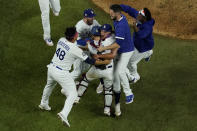 Los Angeles Dodgers celebrate after defeating the Tampa Bay Rays 3-1 to win the baseball World Series in Game 6 Tuesday, Oct. 27, 2020, in Arlington, Texas. (AP Photo/David J. Phillip)