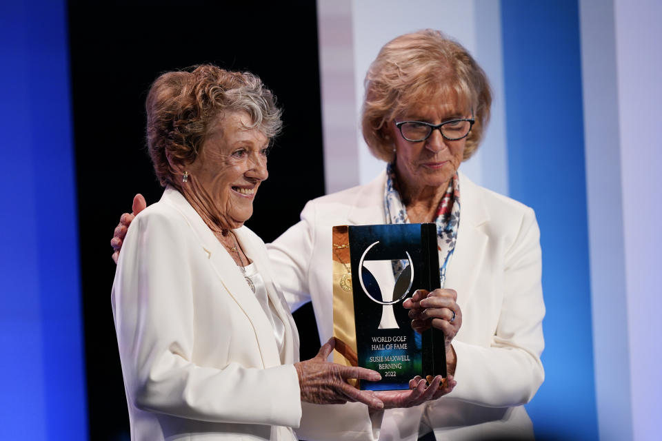 CORRECTS ORDER OF IDS - Susie Maxwell Berning, left, is inducted into the World Golf Hall of Fame by Judy Rankin on Wednesday, March 9, 2022, in Ponte Vedra Beach, Fla. (AP Photo/Gerald Herbert)