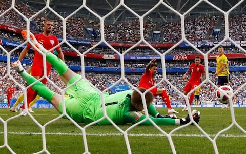 Jordan Pickford makes a fine save from Sweden's Viktor Claesson, diving to his right - Credit: REUTERS/Michael Dalder