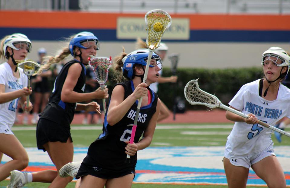 Bartram Trail's Ava Allamon (2) advances against Ponte Vedra during the Rivalry on the River high school lacrosse tournament.