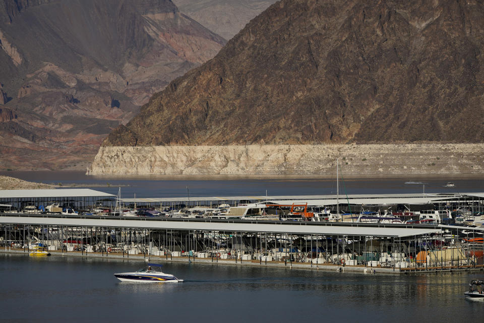 FILE - In this Aug. 13, 2020, file photo, a bathtub ring of light minerals delineates the high water mark on Lake Mead at the Lake Mead National Recreation Area near Boulder City, Nev. A key reservoir on the Colorado River is expected to match its record low level on Thursday, June 10, 2021. The dropping surface elevation of Lake Mead along the Arizona-Nevada border is the another sign of the drought's grip on the region. (AP Photo/John Locher, File)