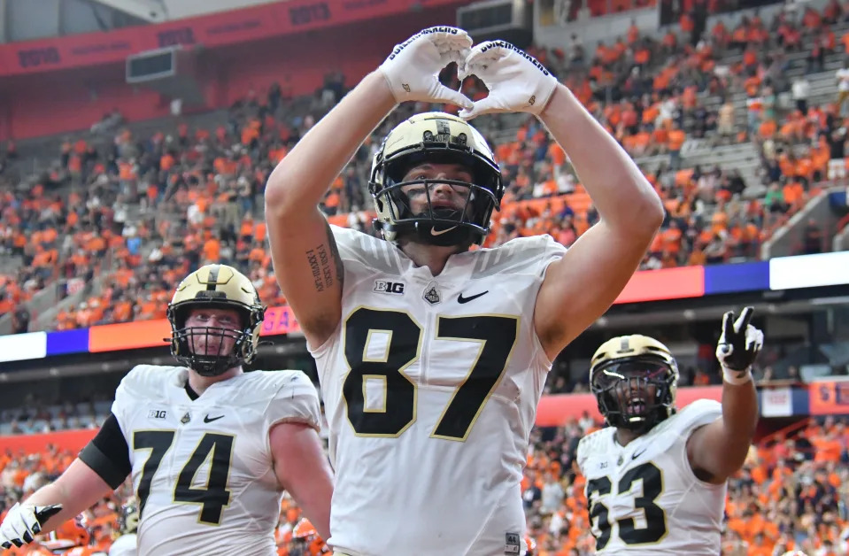Sep 17, 2022; Syracuse, New York, USA; Purdue Boilermakers tight end Payne Durham (87) makes a heart sign to acknowledge a group of Boilermaker fans after scoring a touchdown in the fourth quarter against the Syracuse Orange at JMA Wireless Dome. Mandatory Credit: Mark Konezny-USA TODAY Sports
