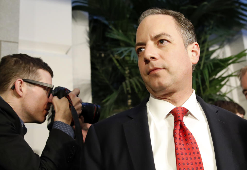 FILE - In a March 23, 2017 file photo, White House Chief of Staff Reince Priebus, right, departs after a Republican caucus meeting on Capitol Hill, in Washington. Speaking on "Fox News Sunday," March 26, 2017, Priebus made clear that President Donald Trump would be seeking support from moderate Democrats for upcoming legislative battles. (AP Photo/Alex Brandon, File)