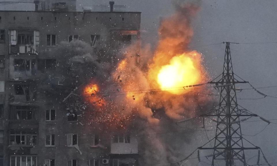 An explosion in an apartment building that came under fire from a Russian army tank.