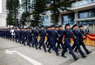 Members of the Hong Kong Police Force march during the ceremonial opening of the legal year at Edinburgh Place in Hong Kong