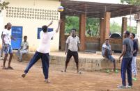 Asylum-seekers who arrived from Libya, play at the United Nations emergency transit centre in Gashora