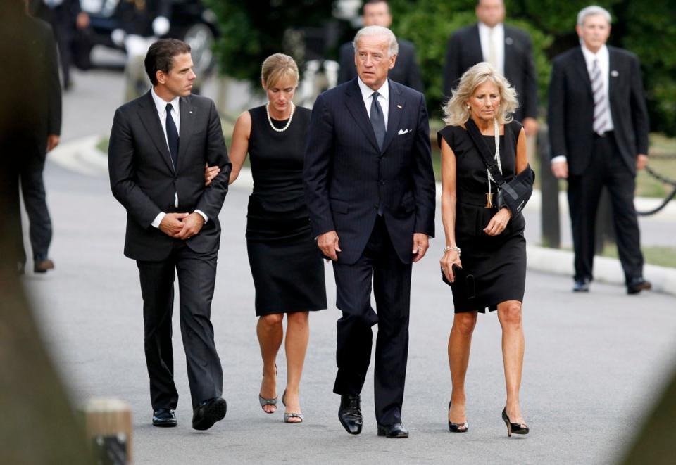 Hunter Biden (far left) walks with his wife Kathleen Buhle (center left) while attending the trial of Senator Edward Kennedy on 29 August 2009 (Getty Images)
