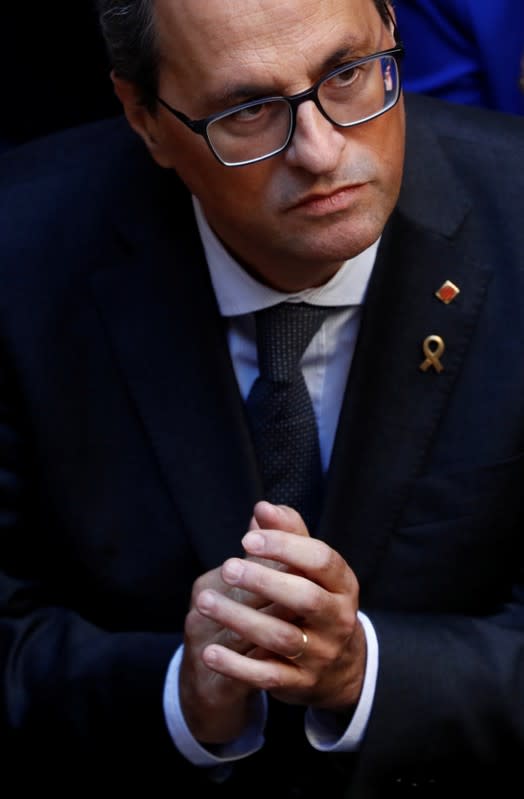 Catalan leader Quim Torra reacts as he meets with mayors of Catalonia region, at the Palau de la Generalitat in Barcelona