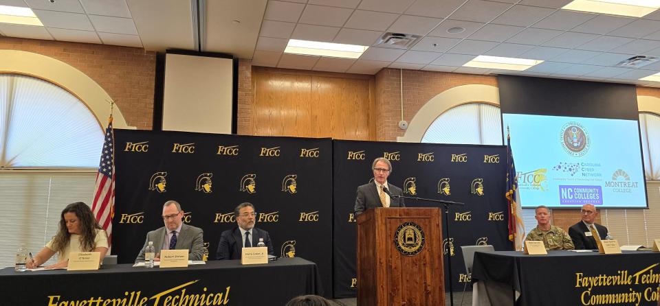 Dr. Mark Sorrells, president of Fayetteville Technical Community College, speaks during an event on cybersecurity jobs on Wednesday, March 20, 2024, at FTCC's Tony Rand Student Center. FTCC hosted Harry Coker Jr., third from left, who is the National Cyber Director. The other panelists from left are Elizabeth O'Brien, executive director of Hiring Our Heroes; Rob Shriver, Deputy Director of the Office of Personnel Management; and Maj. Gen. Colin P. Tuley, 18th Airborne Corps Deputy Commanding General at Fort Liberty; and Paul Maurer, president of Montreat College.