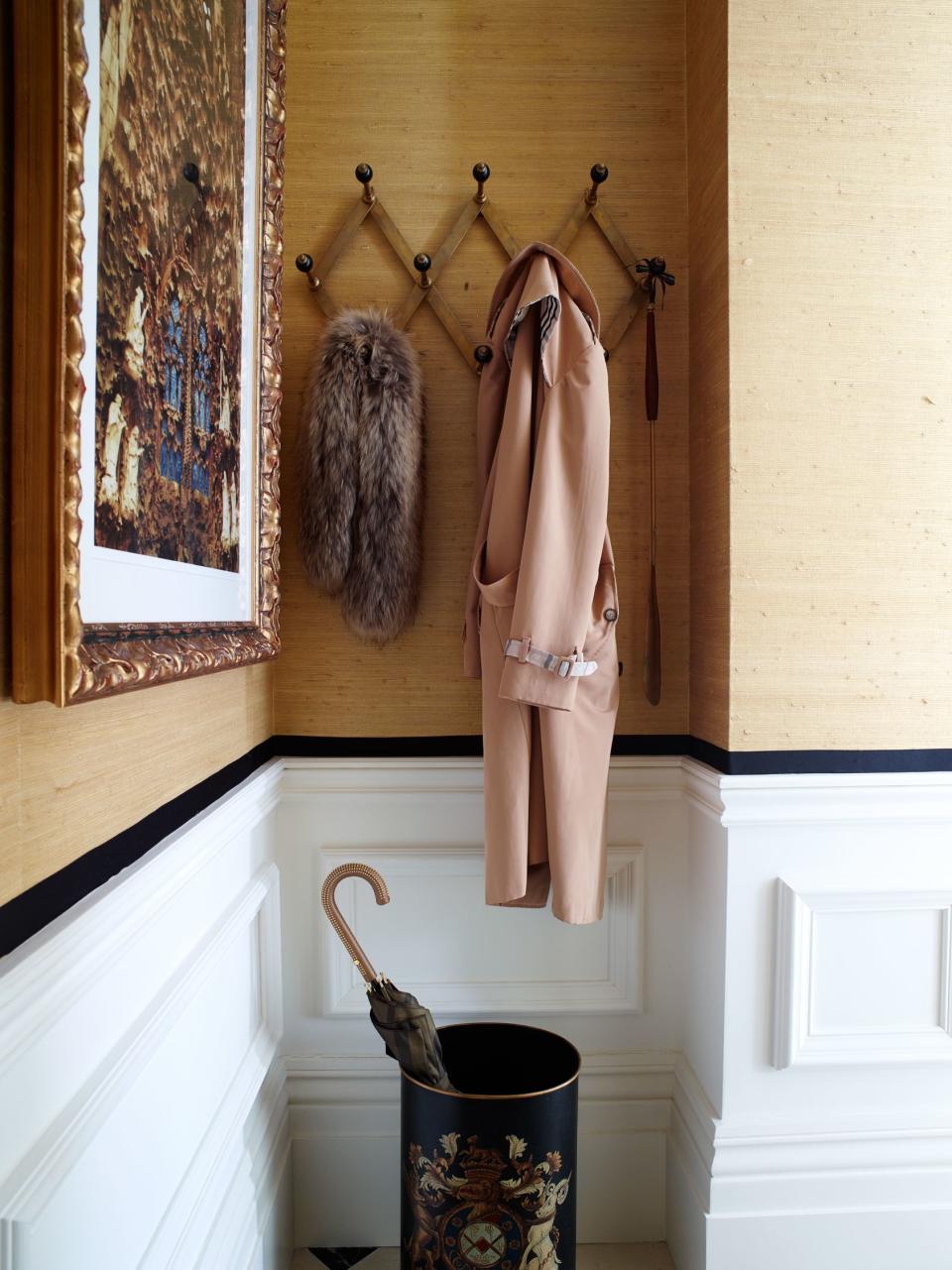 A vintage 1950s wall rack sourced from Valerie Wade is the perfect receptacle for coats in Elspeth Lynn's London townhouse.