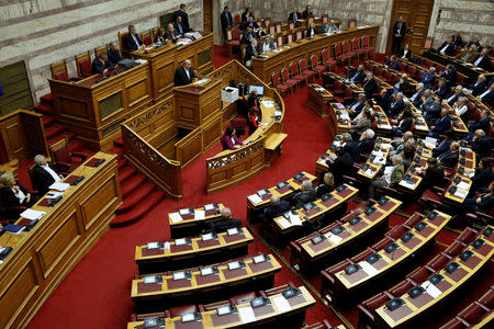 Greek Parliament Speaker Nikos Voutsis addresses lawmakers during a parliamentary session before a vote on German World War II reparations in Athens, Greece April 17, 2019. REUTERS/Costas Baltas