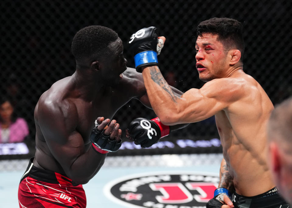 JACKSONVILLE, FLORIDA - JUNE 24:  (L-R) David Onama of Uganda punches Gabriel Santos of Brazil in their featherweight fight during the UFC Fight Night event at Vystar Veterans Memorial Arena on June 24, 2023 in Jacksonville, Florida. (Photo by Josh Hedges/Zuffa LLC)