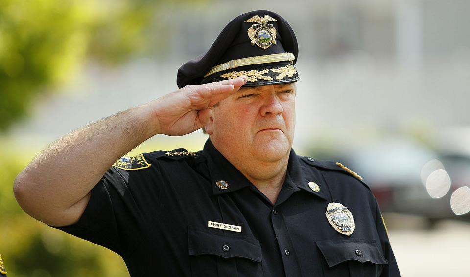 Former Hingham Police Chief Glenn Olsson salutes during a ceremony for Peace Officers Memorial Day at the Hingham police station Tuesday, May 15, 2018.