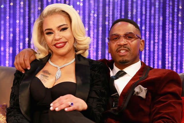 <p>Leon Bennett/Getty</p> Faith Evans and Stevie J in November 2018