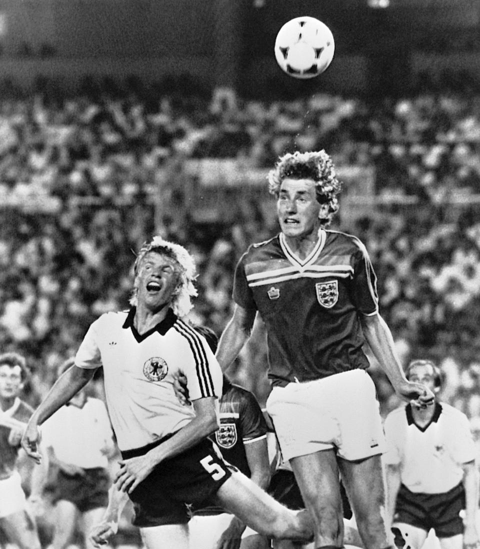 FILE - In this June 29, 1982 file photo England's Terry Butcher, right, heads the ball before West Germany's Bernd Foerster can during the Football World Cup second round match between England and West Germany in Madrid, Spain. The match ended in a 0-0 draw. (AP Photo, File)