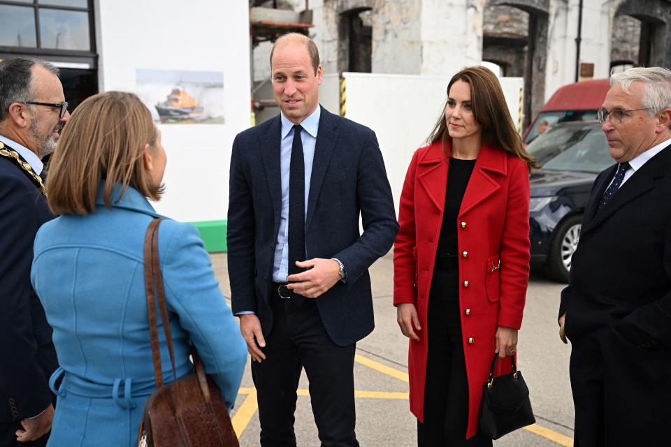 kate middleton wearing red lk bennett coat with prince william, The Prince and Princess of Wales visiting the RNLI (Royal National Lifeboat Institution) Holyhead Lifeboat Station in Anglesey, north west Wales on September 27, 2022. (Getty)