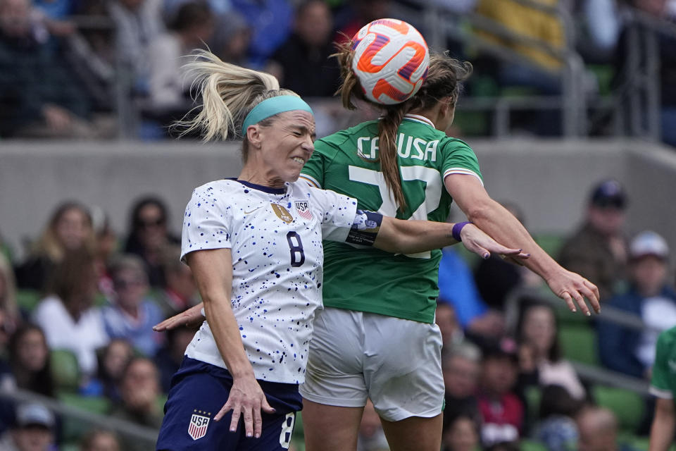 United States midfielder Julie Ertz (8) heads the ball past Ireland forward Kyra Carusa (22) during the second half of an international friendly soccer match in Austin, Texas, Saturday, April 8, 2023. (AP Photo/Eric Gay)