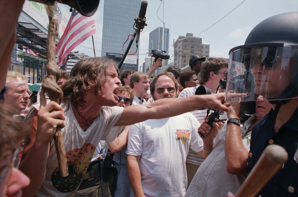 <p>Demonstrators and riot police during a demonstration against the KKK and Neo-Nazi groups near the site of the 1988 Democratic National Convention. (Photo: Getty Images) </p>