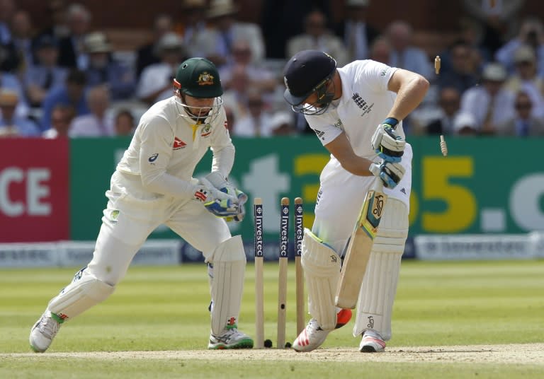 Peter Nevill (left) catches out England's Jos Buttler for 13 runs on the third day of the second Ashes test at Lord's on July 18, 2015