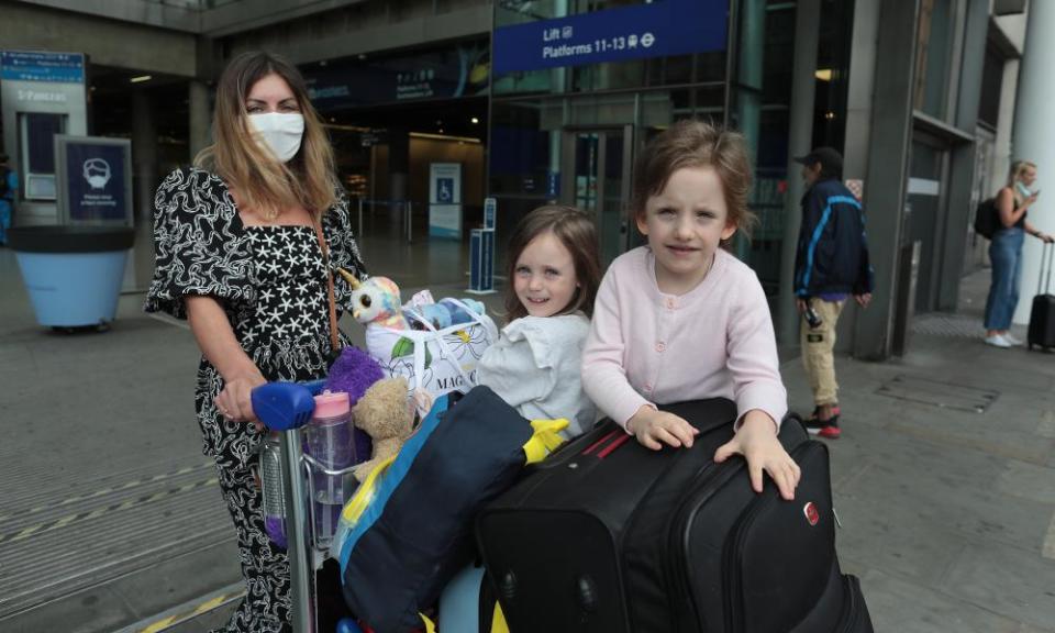 Carina Ignatiuc and her daughters arrive back in London.