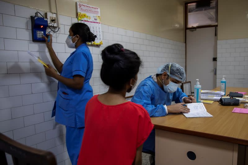 The Wider Image: As COVID ravages India, a 26-year-old doctor decides who lives and who dies