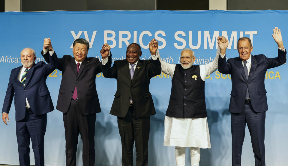 From left, Brazil's President Luiz Inacio Lula da Silva, China's President Xi Jinping, South Africa's President Cyril Ramaphosa, India's Prime Minister Narendra Modi and Russia's Foreign Minister Sergei Lavrov pose for a BRICS group photo during the 2023 BRICS Summit at the Sandton Convention Centre in Johannesburg, South Africa, Wednesday, Aug. 23, 2023. (Gianluigi Guercia/Pool via AP)