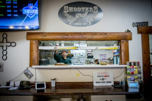 Cooks serve up orders at Shooters Grill in Rifle, Colorado on April 24, 2018