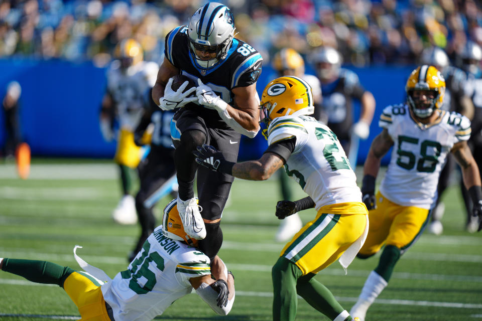 Carolina Panthers tight end Tommy Tremble runs against Green Bay Packers safety Anthony Johnson Jr. (36) and cornerback Jaire Alexander (23) during the first half of an NFL football game Sunday, Dec. 24, 2023, in Charlotte, N.C. (AP Photo/Jacob Kupferman)