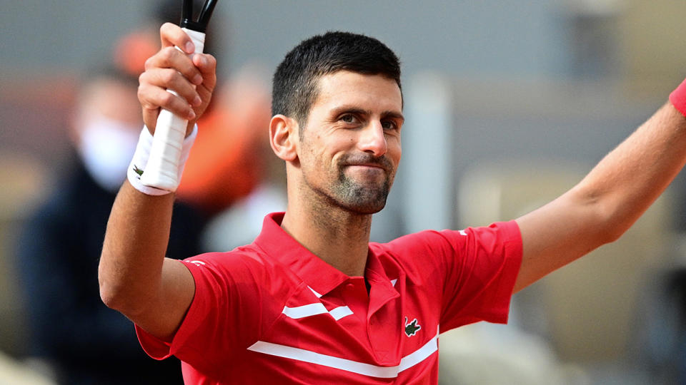 Novak Djokovic celebrates victory over Ricardas Berankis at the French Open. (Photo by MARTIN BUREAU/AFP via Getty Images)