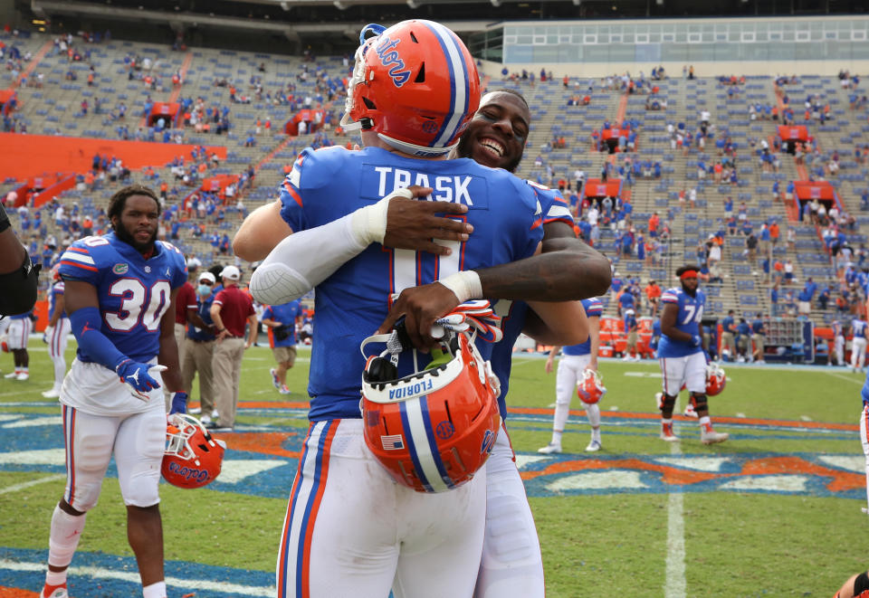 Kyle Pitts #84 and Kyle Trask #11 of the Florida Gators celebrate their victory against the South Carolina Gamecocks on Oct. 3, 2020. (Collegiate Images/Getty Images)