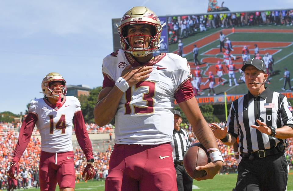 Sep 23, 2023; Clemson, South Carolina, USA; Florida State Seminoles quarterback Jordan Travis (13) reacts after scoring against the Clemson Tigers during the second quarter at Memorial Stadium. Mandatory Credit: Ken Ruinard-USA TODAY Sports