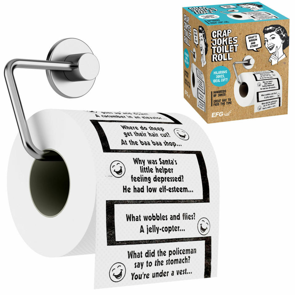 A box of Crap Jokes Toilet roll and the roll itself, with jokes like "What did the policeman say to the stomach? You're under a vest"