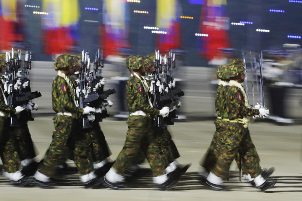 Myanmar military officers march during a parade to commemorate Myanmar's 79th Armed Forces Day, in Naypyitaw, Myanmar, Wednesday, March 27, 2024. (AP Photo/Aung Shine Oo)