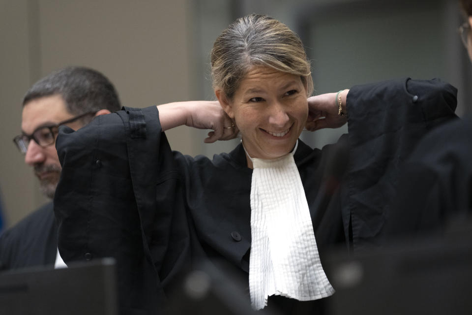 Main defence lawyer Jennifer Naouri, prepares for the trial of Mahamat Said Abdel Kani at the International Criminal Court in The Hague, Netherlands, Monday, Sept. 26, 2022. The trial of an alleged commander in a mainly Muslim rebel group from Central African Republic opened and charged Said with crimes against humanity and war crimes. (AP Photo/Peter Dejong, Pool)