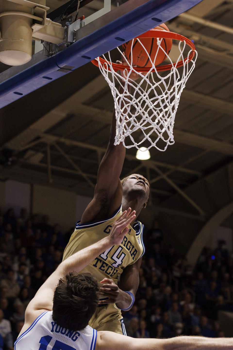 Georgia Tech's Kowacie Reeves dunks over Duke's Ryan Young (15) during the first half of an NCAA college basketball game in Durham, N.C., Saturday, Jan. 13, 2024. (AP Photo/Ben McKeown)