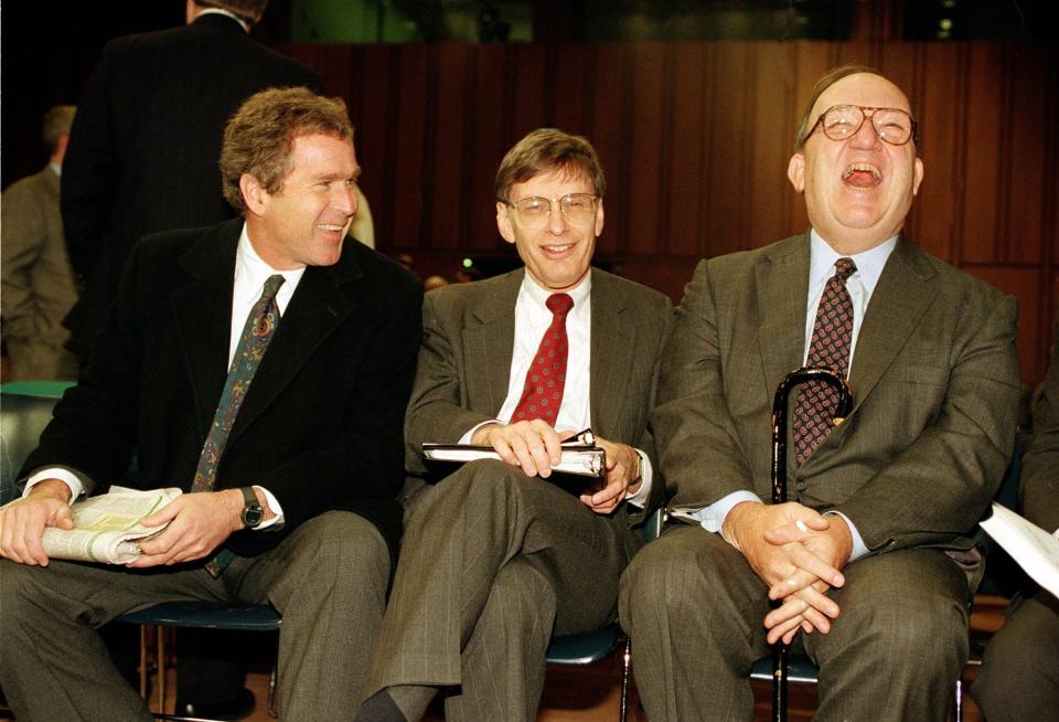 Former Major League Baseball Commissioner Fay Vincent (right) laughs with George W. Bush Jr. (left) owner of the Texas Rangers, and Bud Selig, owner of the Milwaukee Brewers, on Capitol Hill before a Senate Judiciary Committee in Washington, D.C., Dec. 10, 1992.  The committee is holding hearings which could lead to the repeal of baseball's antitrust exemption.