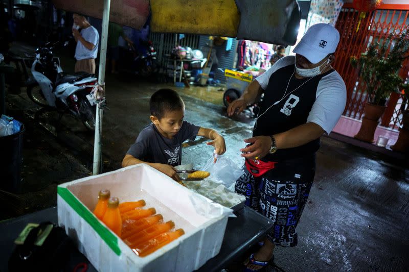 The Wider Image: Punching out of poverty: Despite risks, nine-year-old Thai fighter eager to return to ring