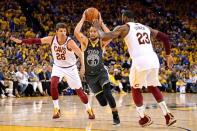 June 3, 2018; Oakland, CA, USA; Golden State Warriors guard Stephen Curry (30) drives to the basket against Cleveland Cavaliers forward LeBron James (23) and guard Kyle Korver (26) during the fourth quarter in game two of the 2018 NBA Finals at Oracle Arena. Kyle Terada-USA TODAY Sports