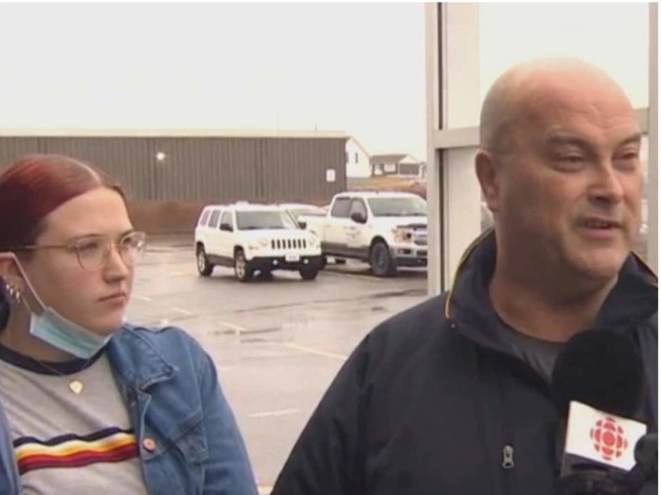 From left to right, Marlene Renouf and Samantha and Steve LeFrense were among the Port aux Basques-area residents stocking up at the grocery store Thursday morning. Damaged roads have cut the region off from the rest of Newfoundland. (Danny Arsenault/CBC - image credit)