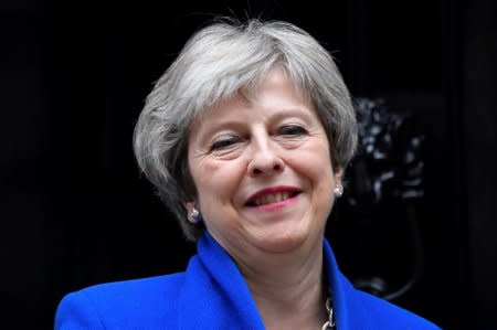 Britain's Prime Minister Theresa May emerges from 10 Downing Street in London, Britain, June 20, 2018. REUTERS/Toby Melville